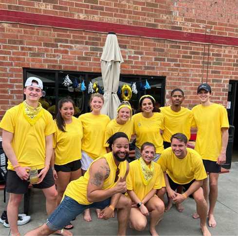 Optomi Professional Services When In Charlotte North Carolina VBGB Beer Hall and Garden Restaurant Milestone Volleyball Tournament Celebration gold team