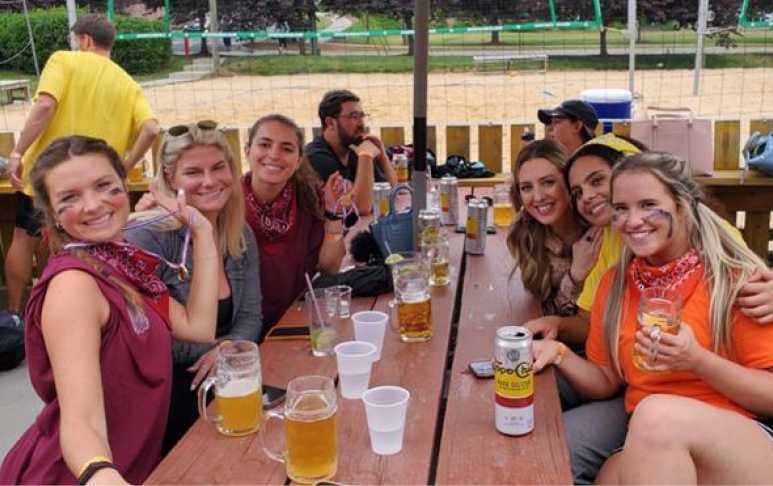 Optomi Professional Services When In Charlotte North Carolina VBGB Beer Hall and Garden Restaurant Milestone Volleyball Tournament Celebration cheers