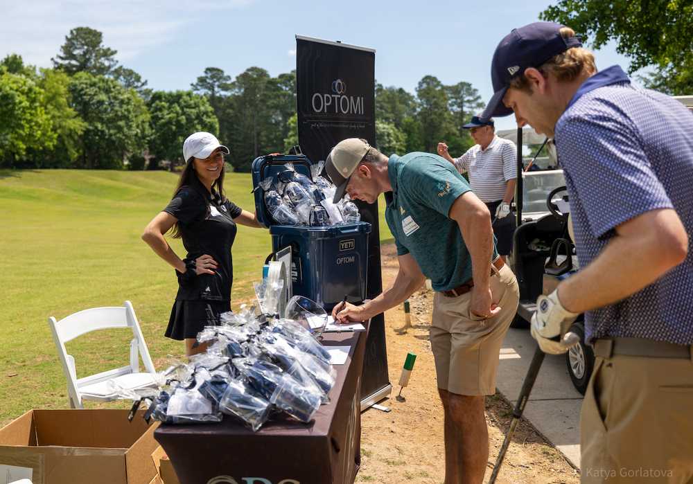 Optomi Charlotte Community Involvement SIM Golf Event table