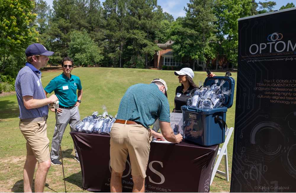 Optomi Charlotte Community Involvement SIM Golf Event networking